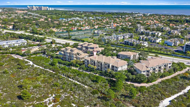an aerial view of a house with a garden
