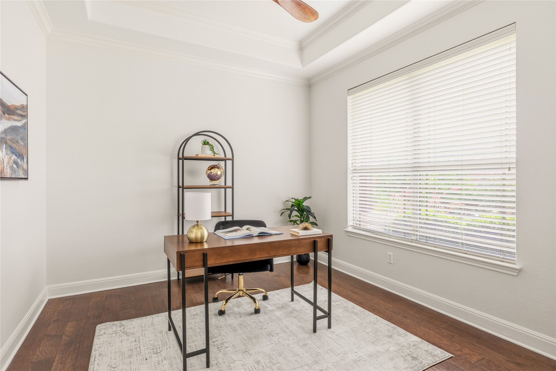 1432 Tom Sawyer Road Austin, TX 78737 - Photo 6 of 33 A well-lit home office on the first floor provides an ideal work-from-home environment, featuring elegant hardwood flooring and a stylish tray ceiling.