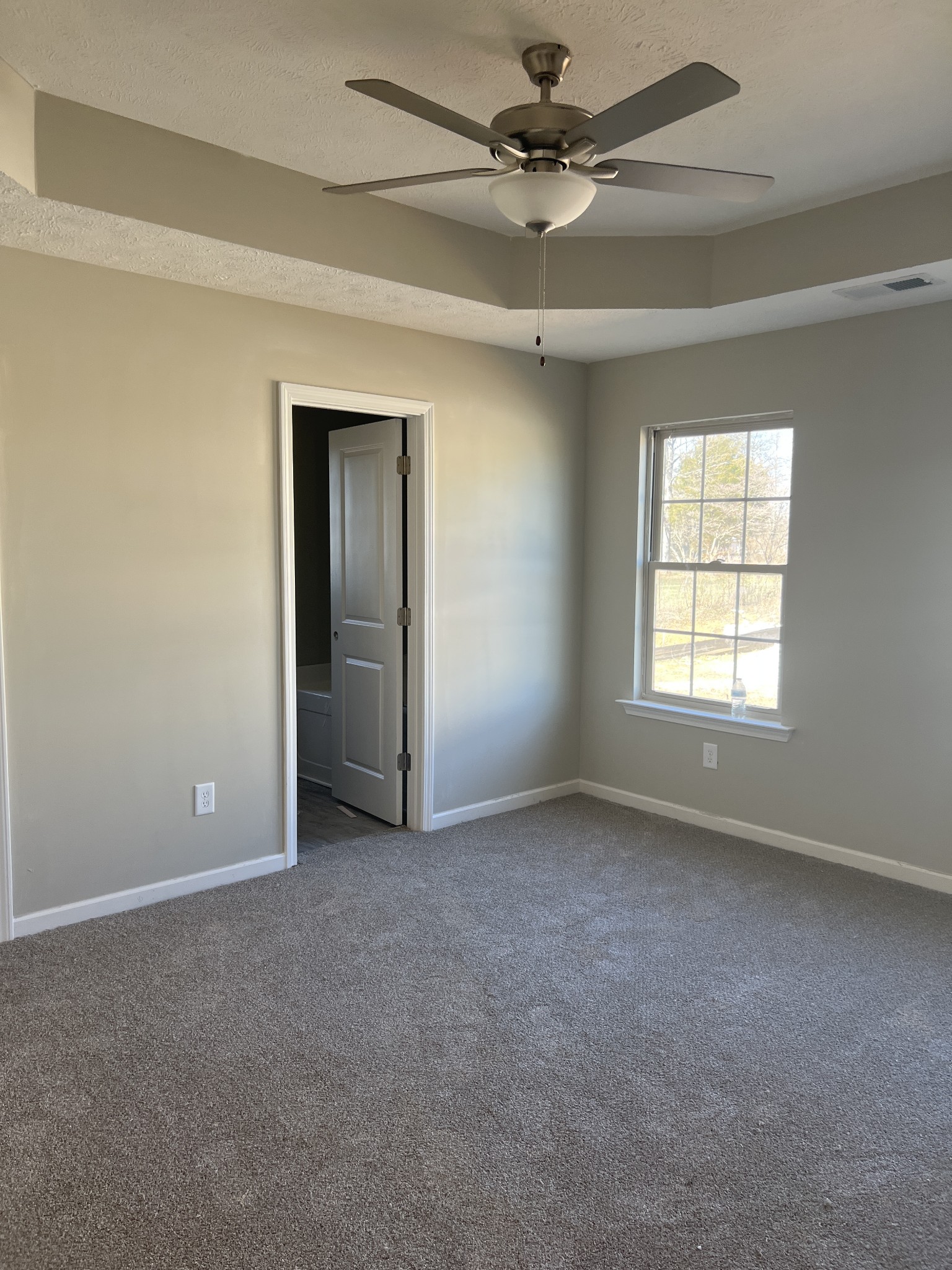219 Timber Circle Manchester, TN 37355 - Photo 6 of 8 an empty room with windows and fan