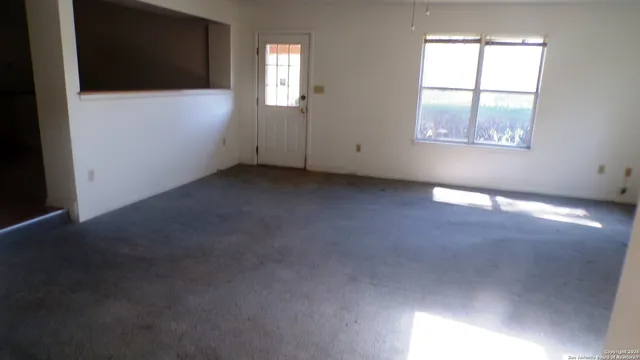 an empty room with windows
