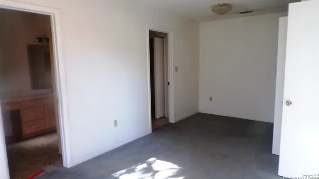 a view of a room with a hallway