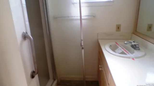 a white toilet sitting next to a sink