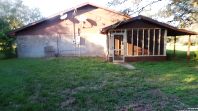 a view of a back yard of the house