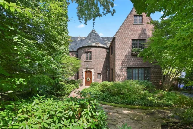 front view of a house with a garden