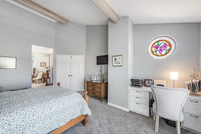 a bedroom with a bed and furniture