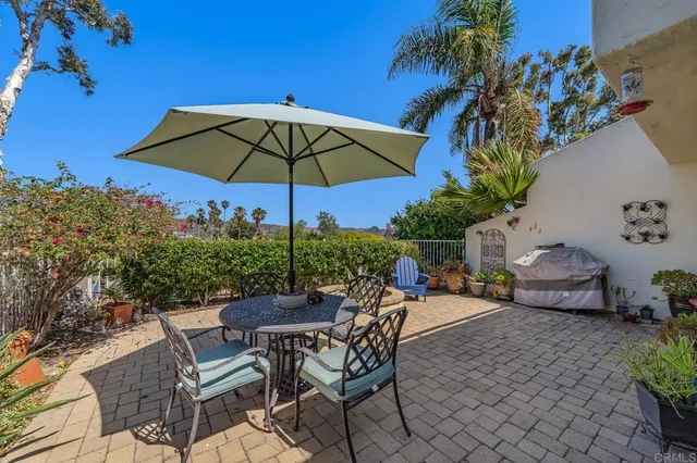 a view of a backyard with furniture and a table