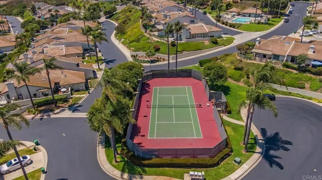 an aerial view of a house with a garden and swimming pool