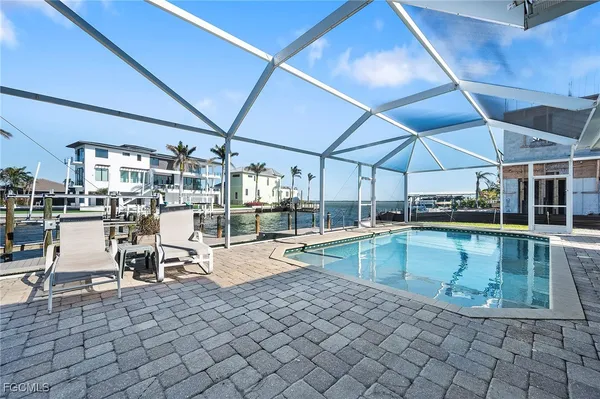 a view of a swimming pool with chairs