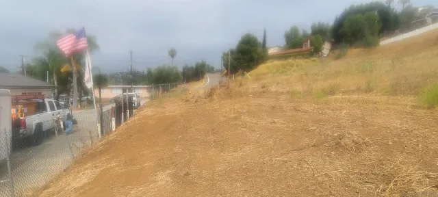 a view of a pathway both side of house