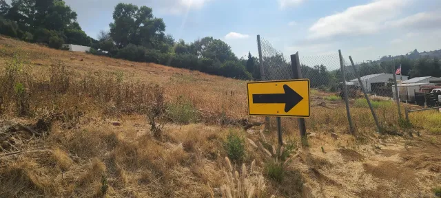 a view of a lake with a yard