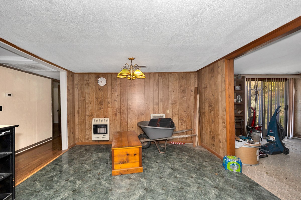 1121 Rolin Hollow Road Ardmore, TN 38449 - Photo 9 of 46 a view of a room with gym equipment and large windows