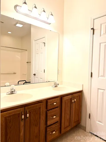 a white toilet sitting next to a bathroom sink