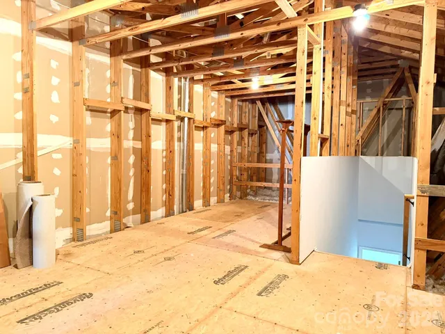 a building exterior with a building and wooden floor