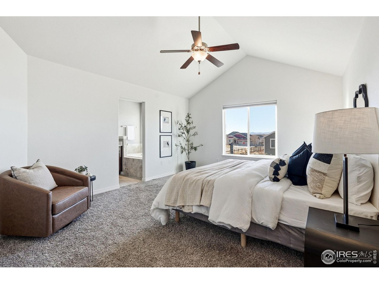 551 Capitol Reef Court Berthoud, CO 80513 - Photo 15 of 42 Main floor primary features incredible Front Range views and vaulted ceiling