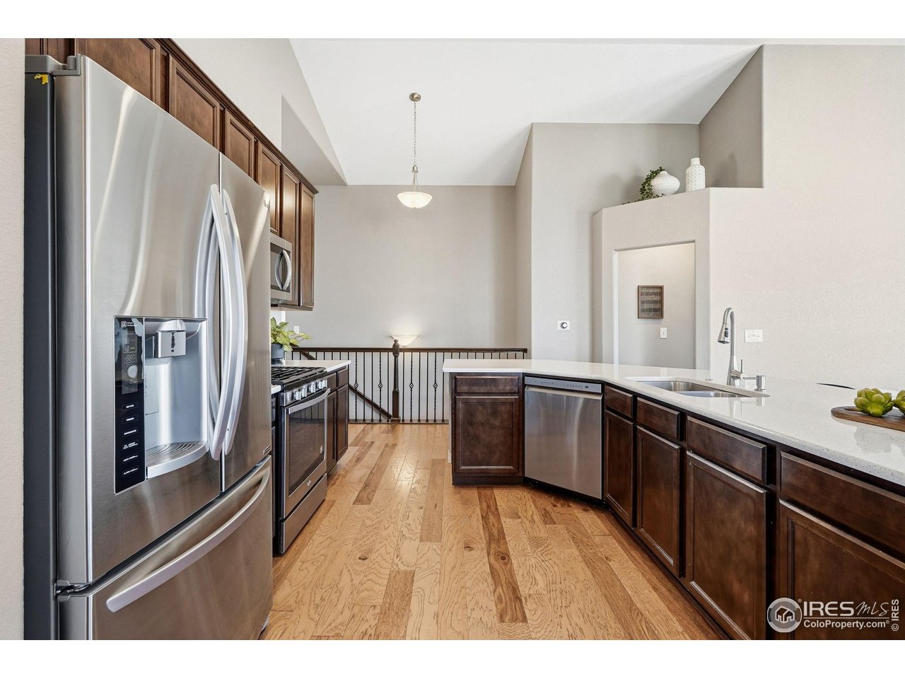 551 Capitol Reef Court Berthoud, CO 80513 - Photo 8 of 42 Beautiful open kitchen with stainless steel appliances