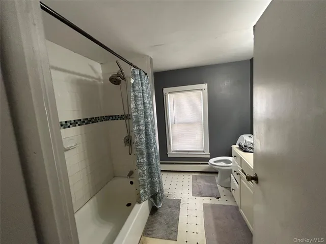 a bathroom with a bath tub and a shower