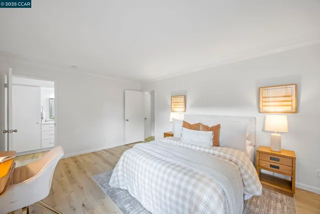 a bedroom with a bed and a couch