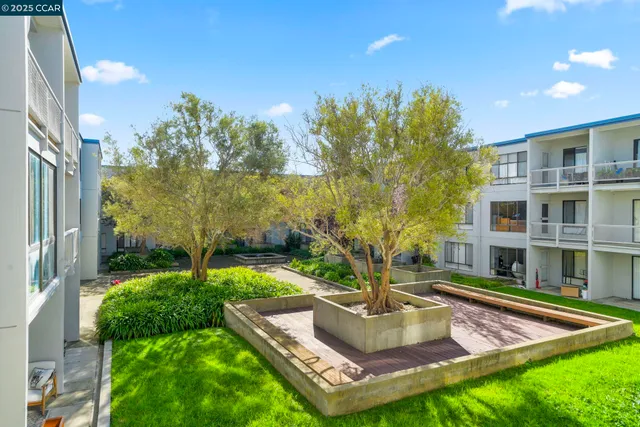 a living room with glass floor and windows