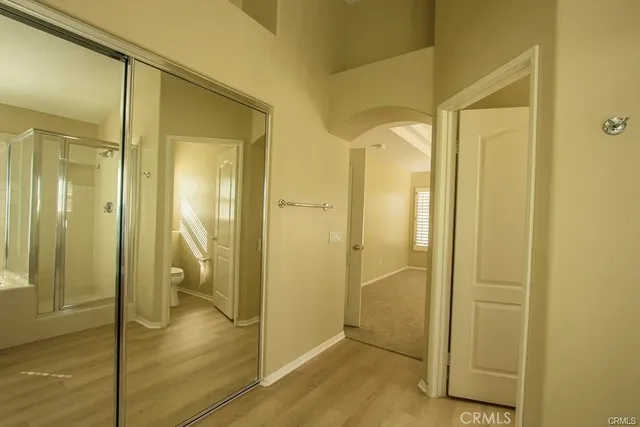 a bathroom with a glass shower door
