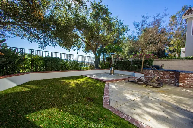 a view of a backyard with sitting area