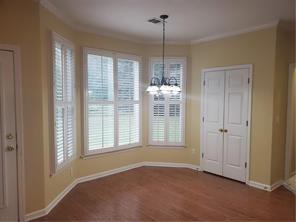 3715 Ridgeside Court Suwanee, GA 30024 - Photo 11 of 44 a view of an empty room with window and cabinet area