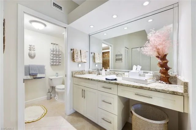 a bedroom with a bed and a cabinets