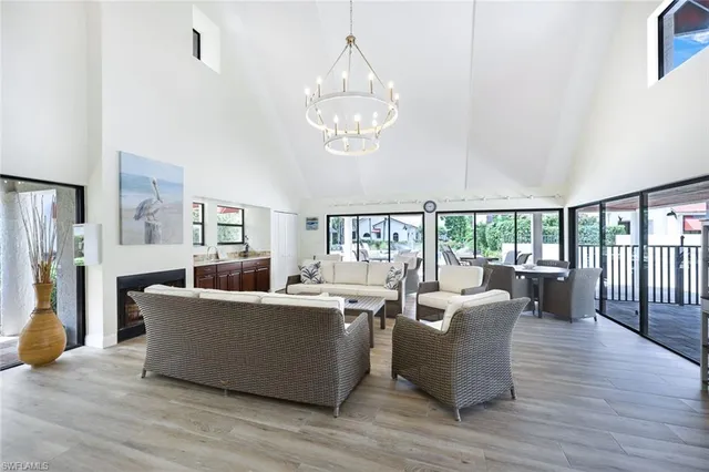 a large kitchen with stainless steel appliances granite countertop a refrigerator and a stove top oven