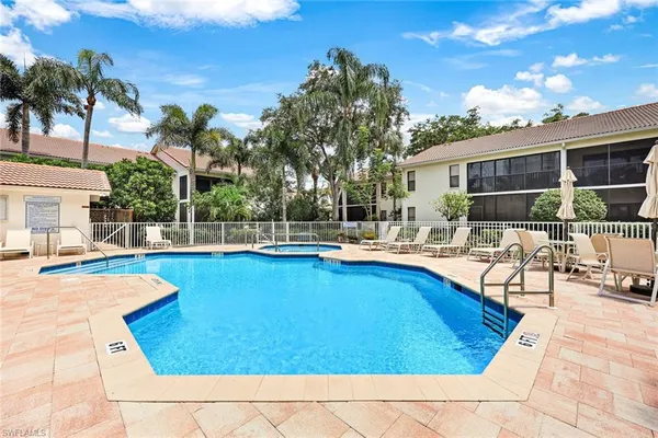 a view of swimming pool with outdoor seating