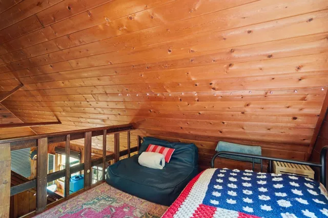 a view of a chairs and table on the wooden floor