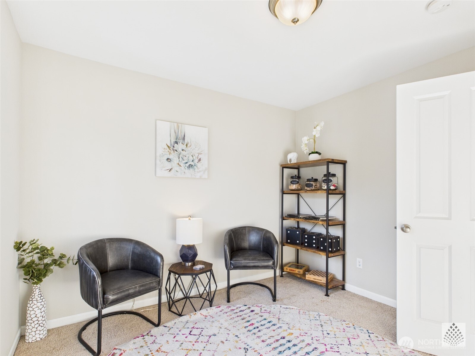 3625 202nd Pl S East Bothell, WA 98012 - Photo 28 of 31 a living room with furniture and a chair