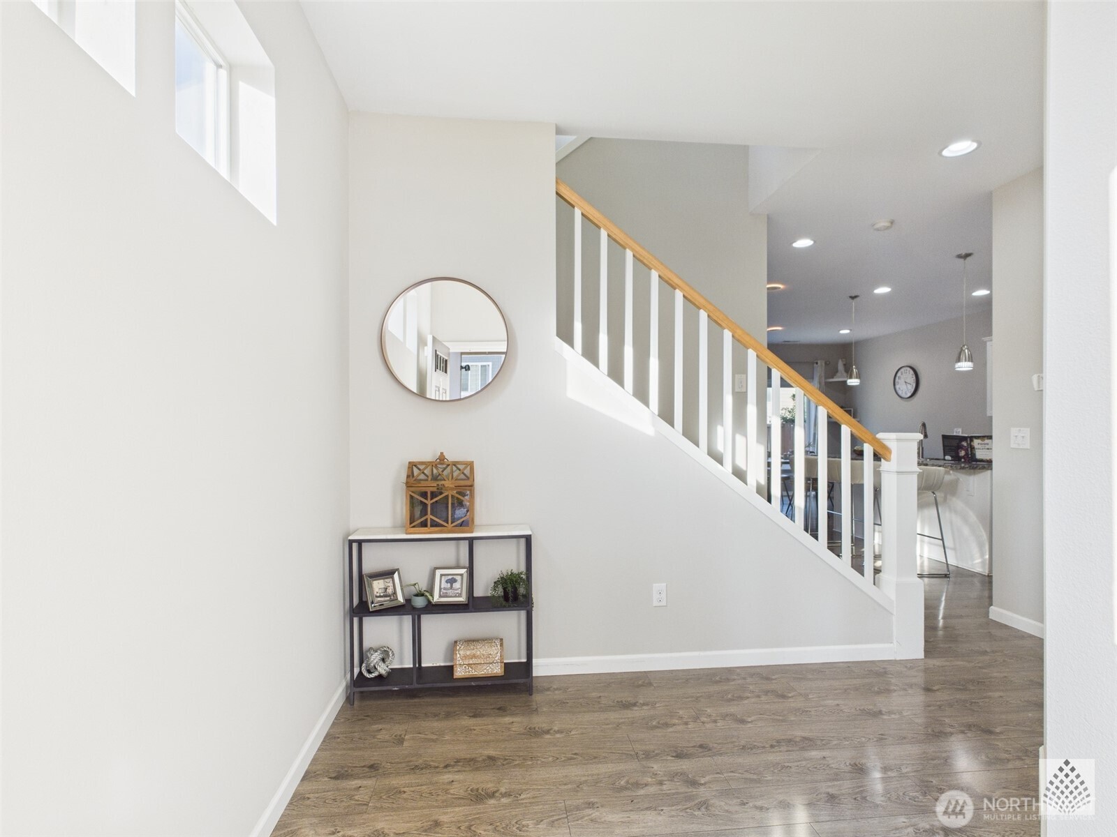 3625 202nd Pl S East Bothell, WA 98012 - Photo 4 of 31 a view of a hallway with wooden floor and entryway