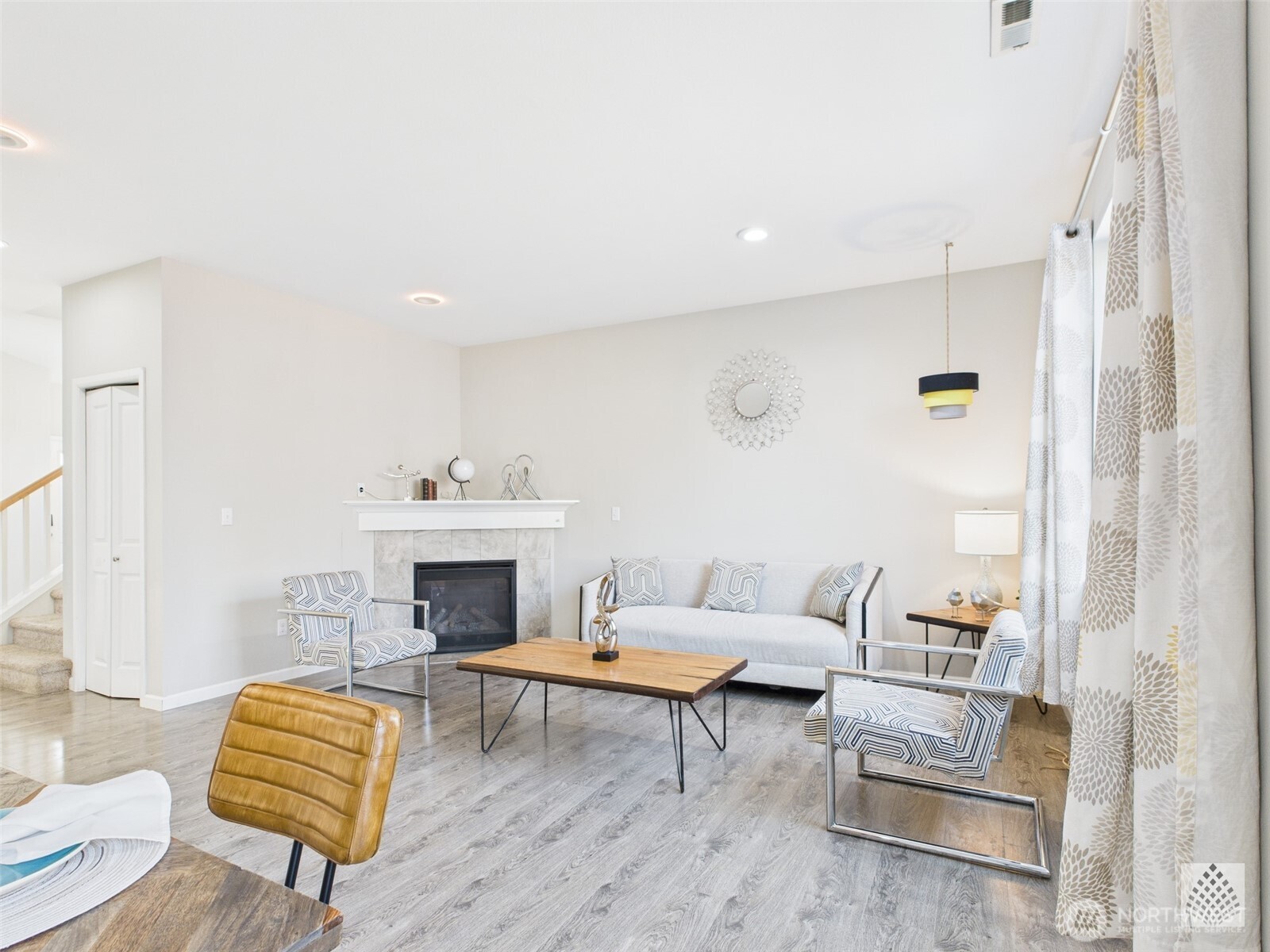 3625 202nd Pl S East Bothell, WA 98012 - Photo 5 of 31 a living room with furniture and a fireplace