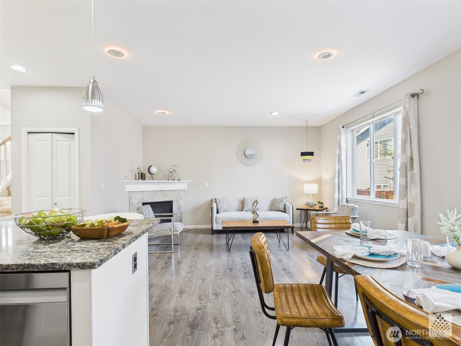 3625 202nd Pl S East Bothell, WA 98012 - Photo 6 of 31 a open kitchen with a table and chairs