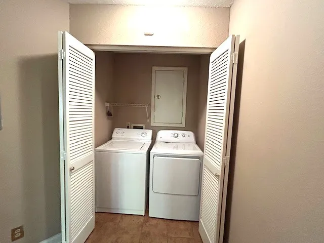 an empty room with windows and entrance