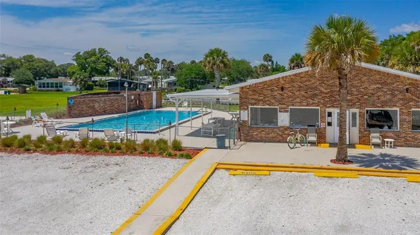 a view of a house with swimming pool