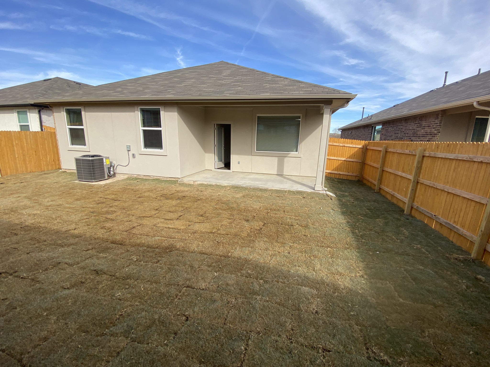 236 Sunniberg Loop Georgetown, TX 78626 - Photo 19 of 22 A spacious, fully fenced yard features a concrete patio and plenty of grassy space.