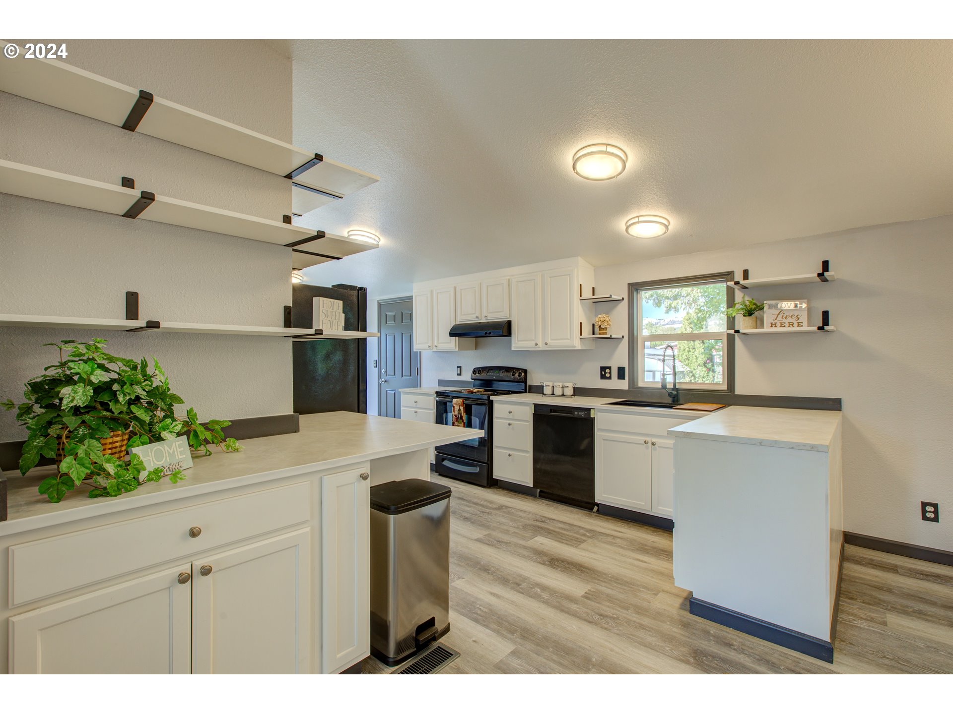 2438 Austin Road Roseburg, OR 97471 - Photo 19 of 48 a kitchen with a refrigerator and a sink
