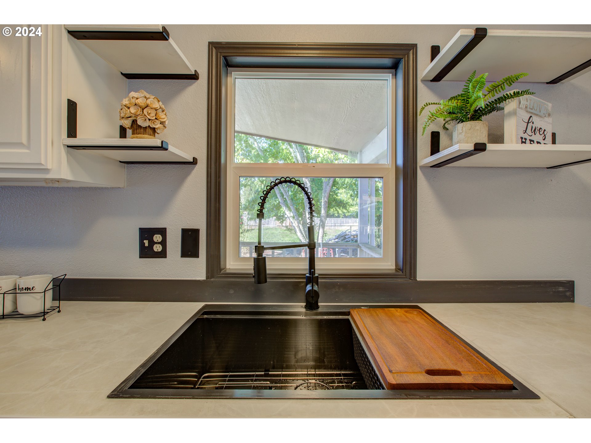 2438 Austin Road Roseburg, OR 97471 - Photo 21 of 48 a kitchen with a sink and a large window