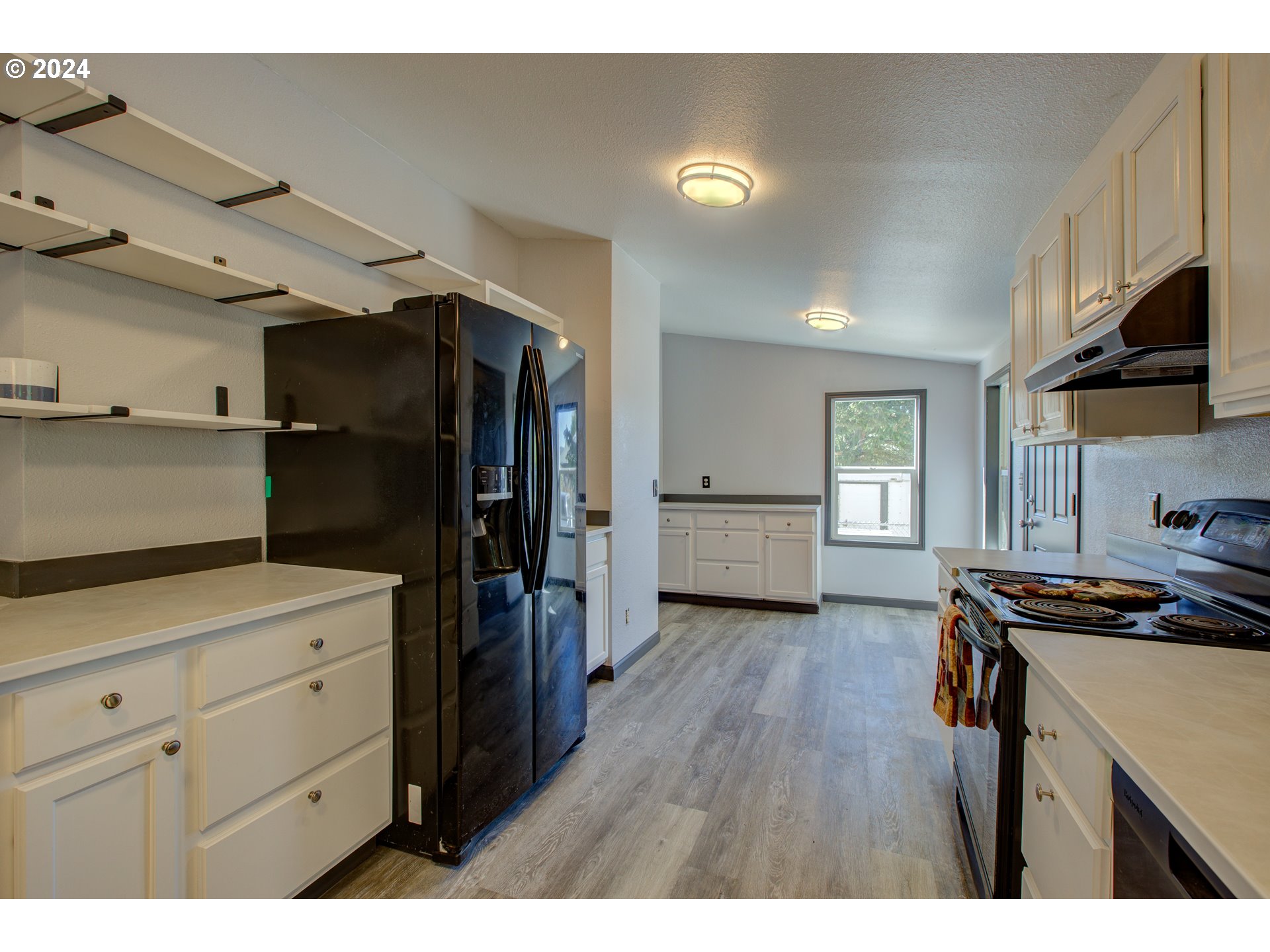 2438 Austin Road Roseburg, OR 97471 - Photo 22 of 48 a kitchen with a refrigerator and a stove