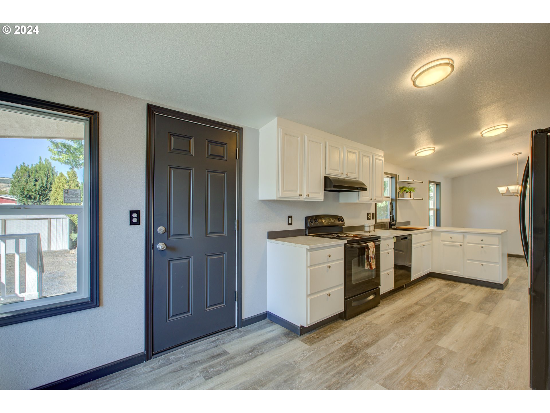 2438 Austin Road Roseburg, OR 97471 - Photo 23 of 48 a kitchen with a refrigerator and a stove top oven