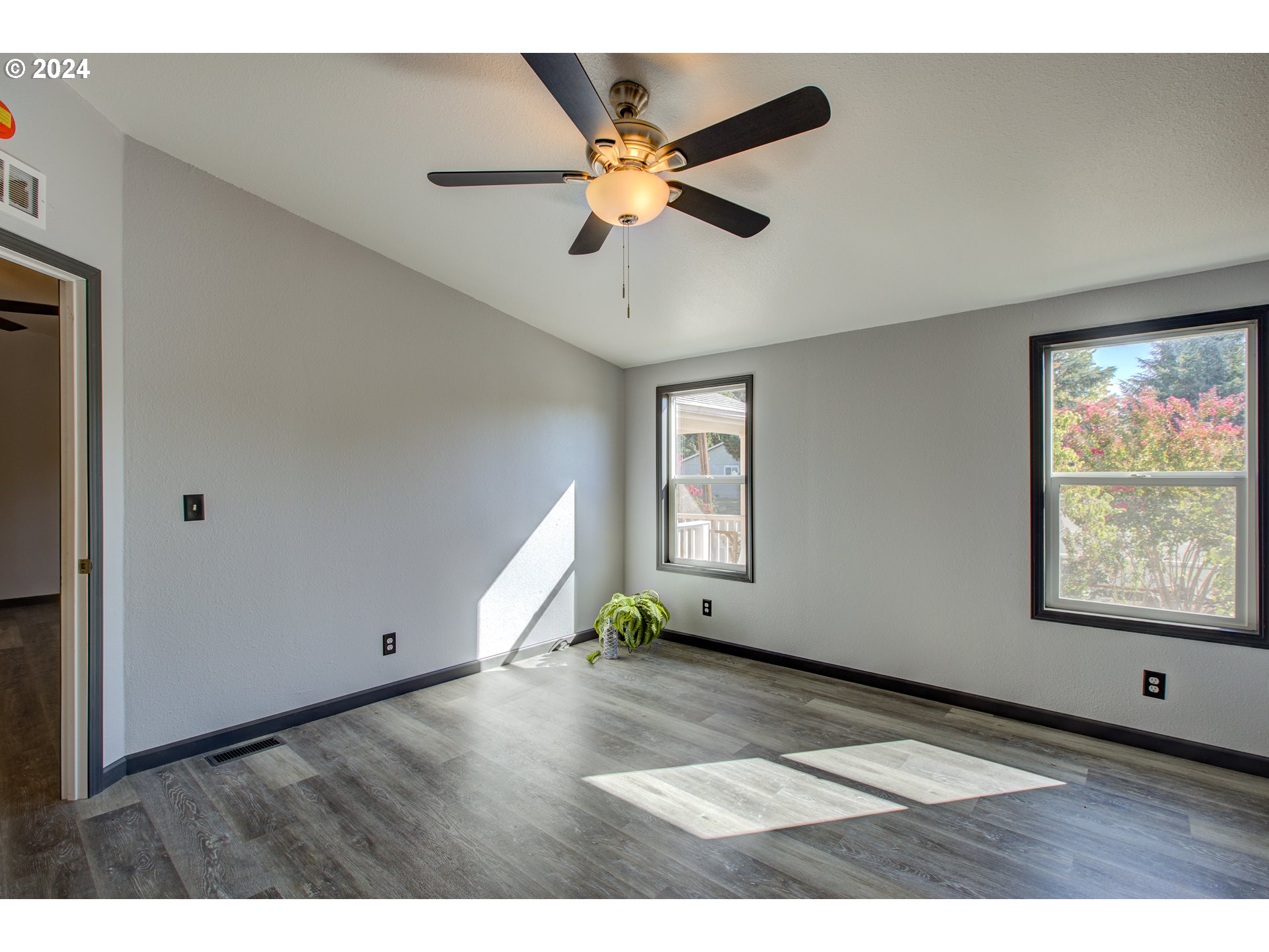 2438 Austin Road Roseburg, OR 97471 - Photo 29 of 48 a view of an empty room with window and wooden floor