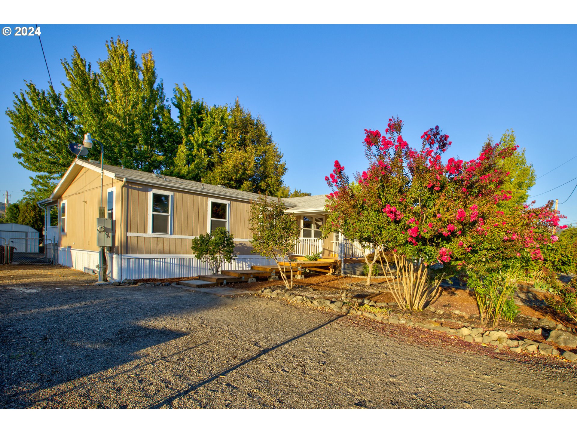 2438 Austin Road Roseburg, OR 97471 - Photo 3 of 48 a backyard of a house with table and chairs