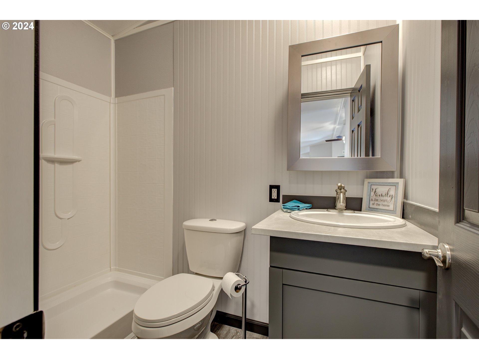 2438 Austin Road Roseburg, OR 97471 - Photo 36 of 48 a bathroom with a toilet sink vanity and mirror
