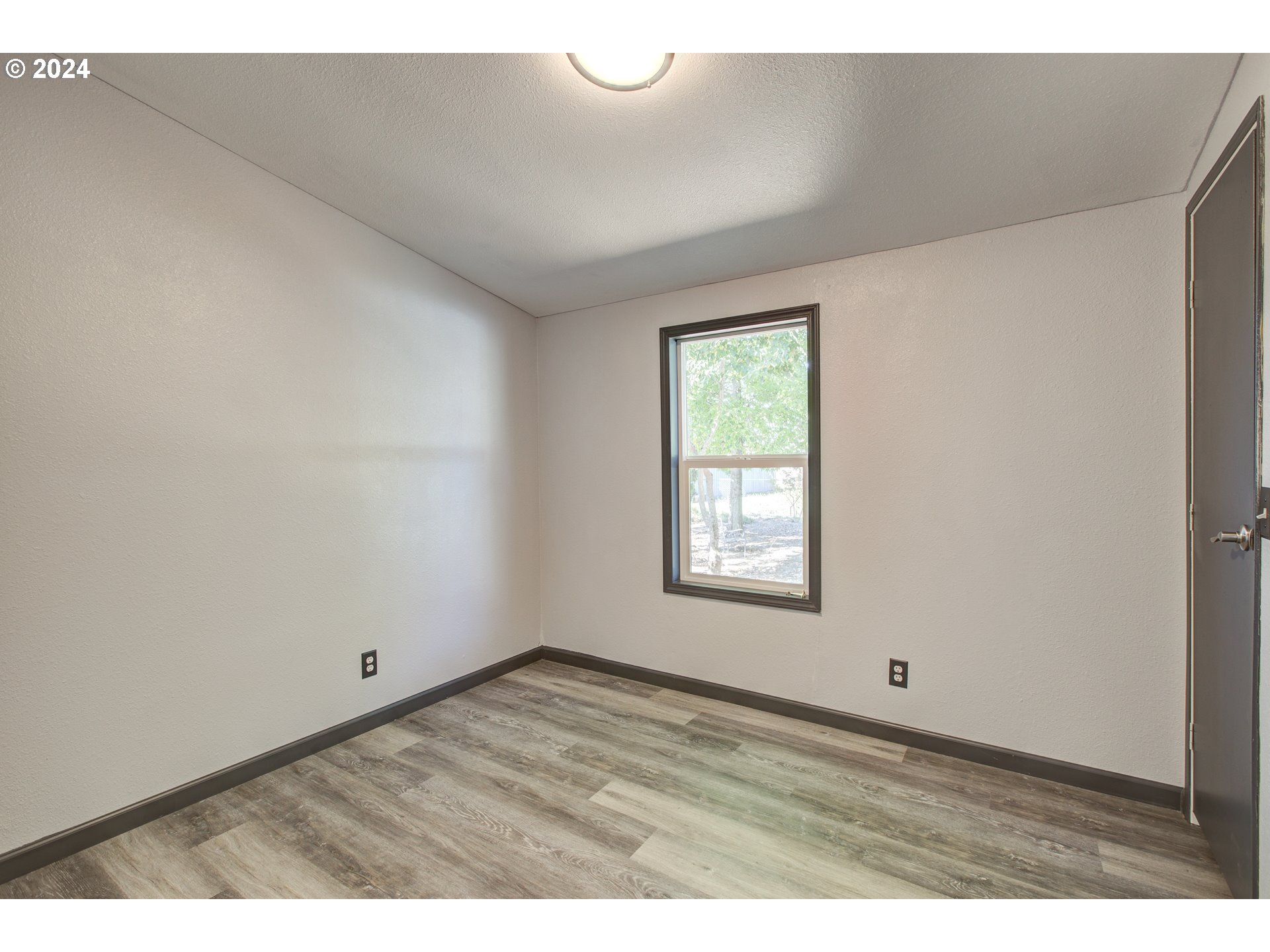 2438 Austin Road Roseburg, OR 97471 - Photo 37 of 48 a view of an empty room and window