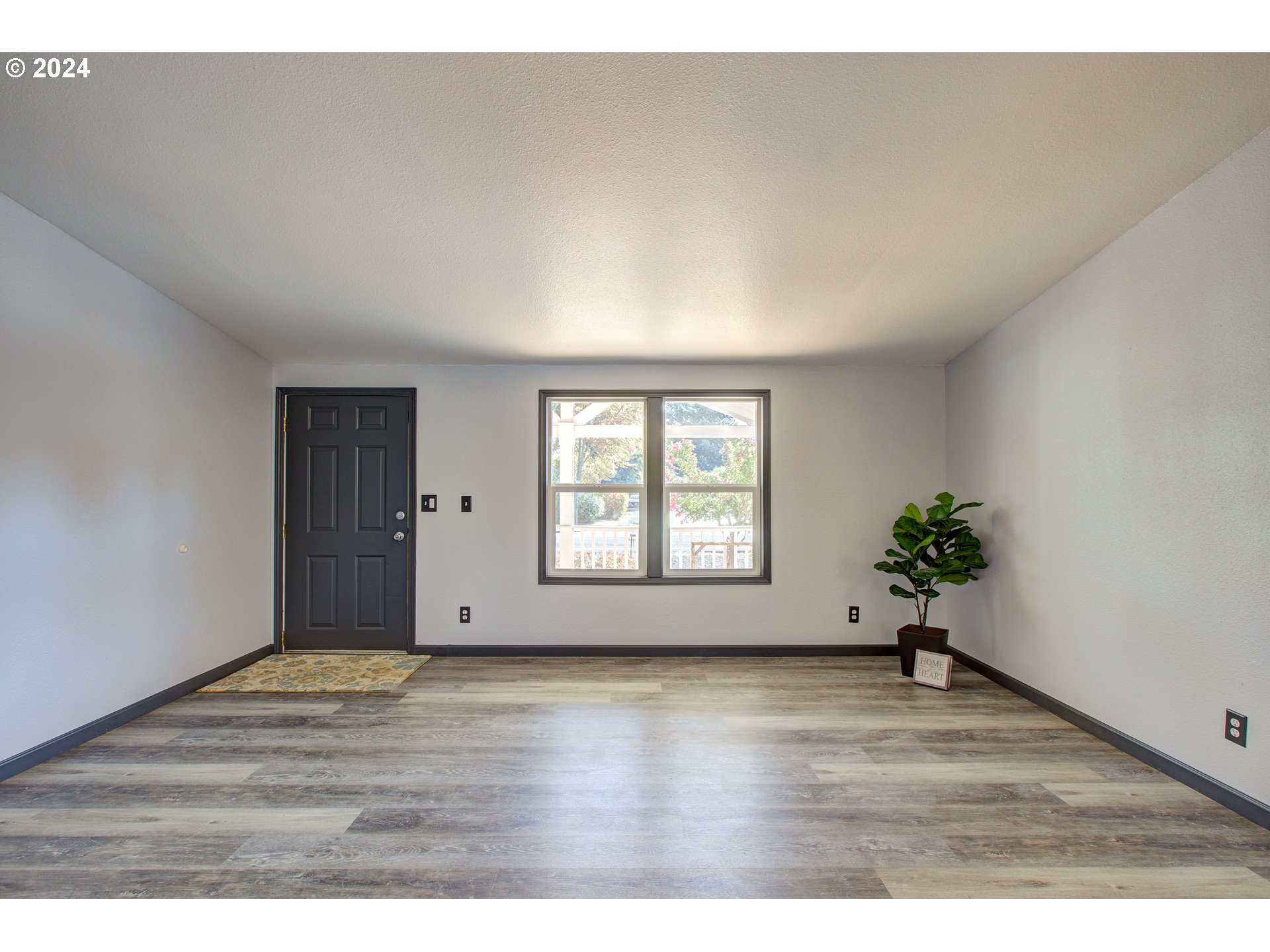 2438 Austin Road Roseburg, OR 97471 - Photo 7 of 48 a view of an empty room with a window