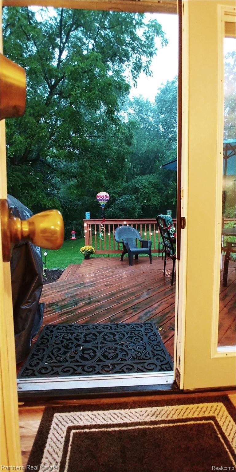 7451 Sanford Road Howell, MI 48855 - Photo 7 of 30 Entry to deck is just off the main living area