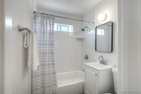 a bedroom with a bed and a lamp