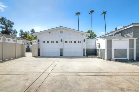 an aerial view of a house with outdoor space