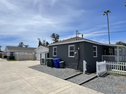 an aerial view of a house with outdoor space and parking
