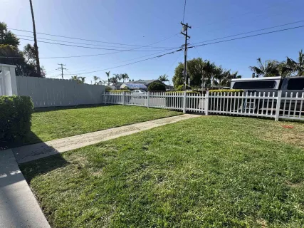 a house with a flower garden in front of it